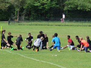 Darrius showing the U13s about stretches